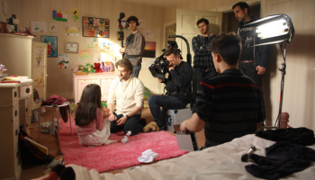 Filming a scene in a bedroom