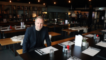 Architect Guy Hollaway, Founder and Principle of Hollaway sitting in Curious Brewery