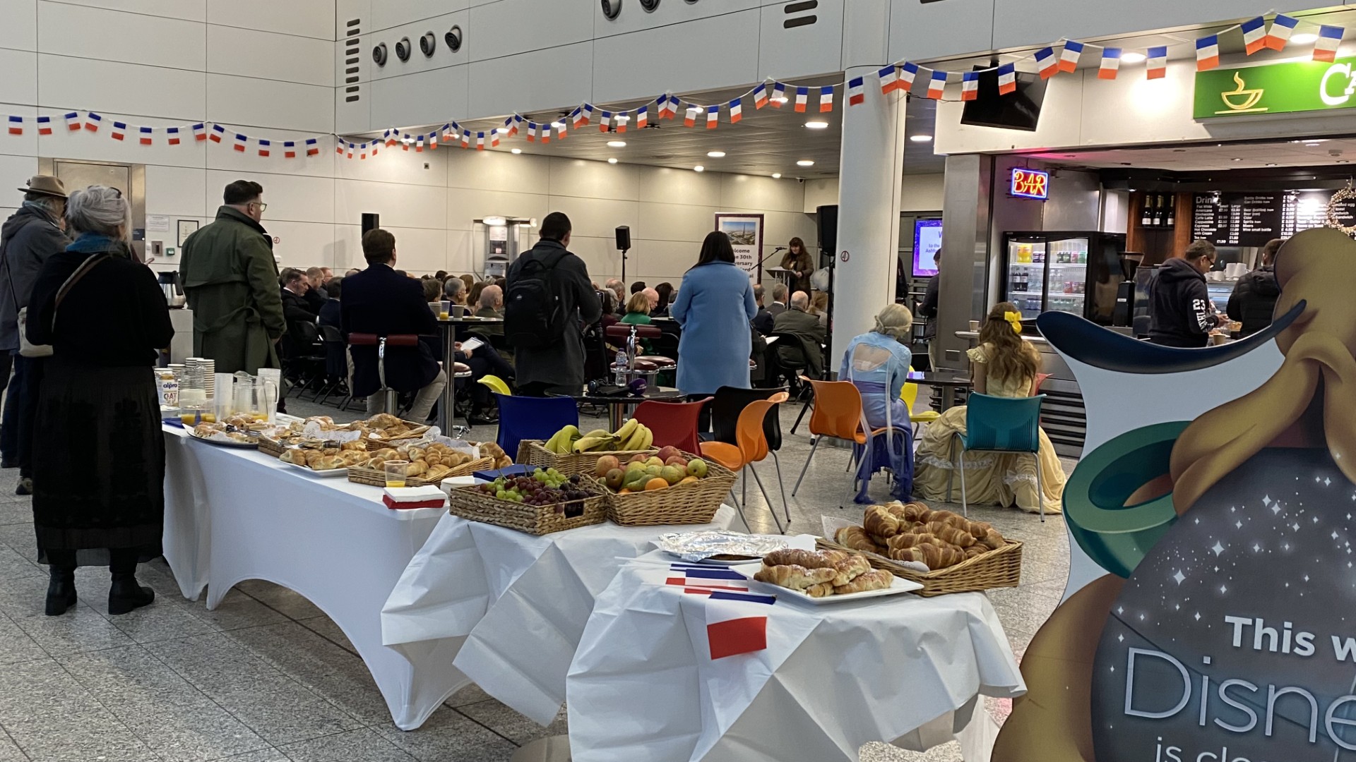 people standing and sitting at an event