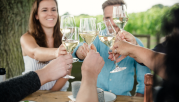A group of people wine tasting with Gusbourne